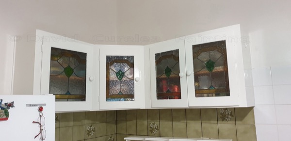 Kitchen cabinetry with painted frames and leadlight glass