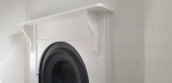 A painted plaster arch and shelf detail